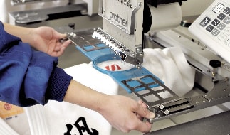 Craftsman embroidering a Judogi